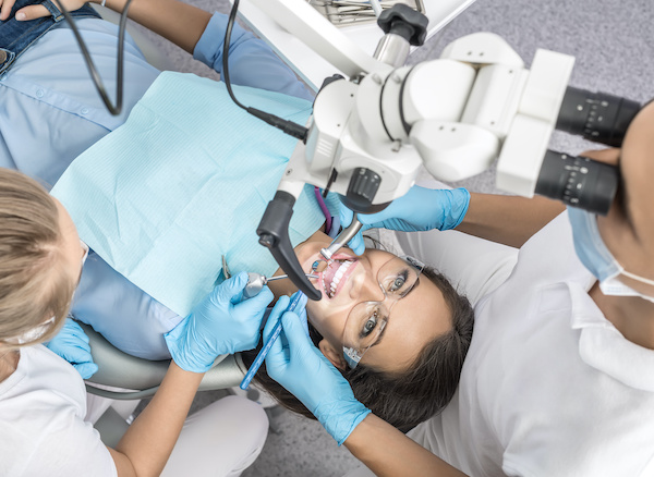 Woman in dental chair | Treatment at endodontist's office | Endodontist Root Canal Specialist