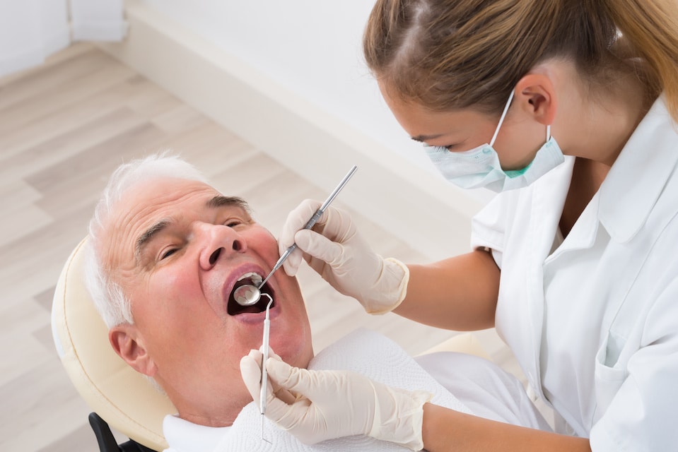 Dentist with Older Patient | My Dental Advocate