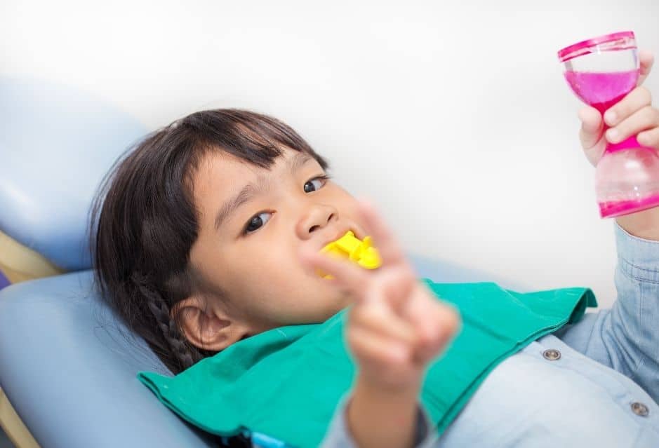 Child getting foam fluoride at the dentist | My Dental Advocate